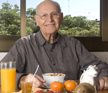 elderly man having meal